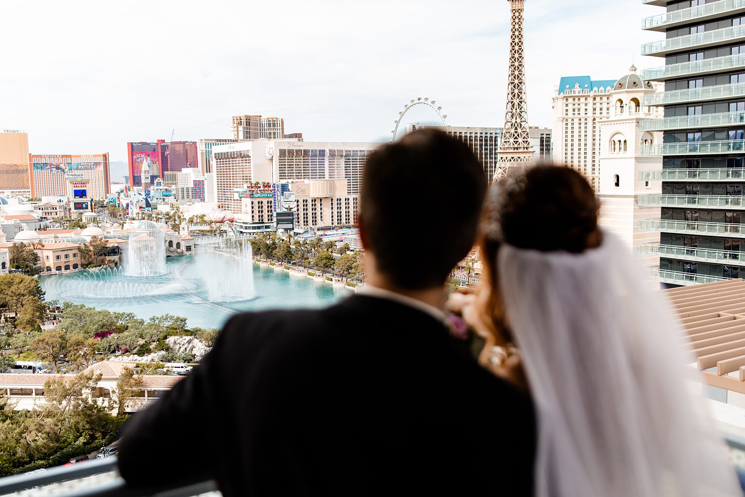 Bride and groom admiring the views from their Cosmopolitan Wraparound Terrace Suite