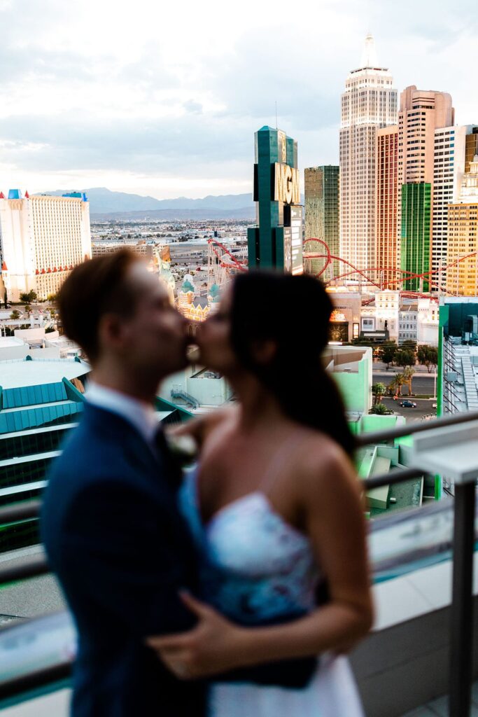 Bride and groom kissing at MGM Skyline Terrace Suite