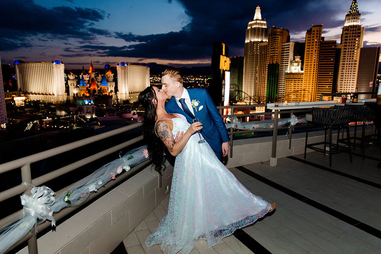 Bride and groom kissing on their MGM Skyline Terrace Suite