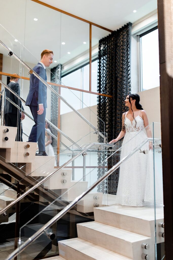 Bride and groom walking down the stairs in their MGM Skyline Terrace Suite