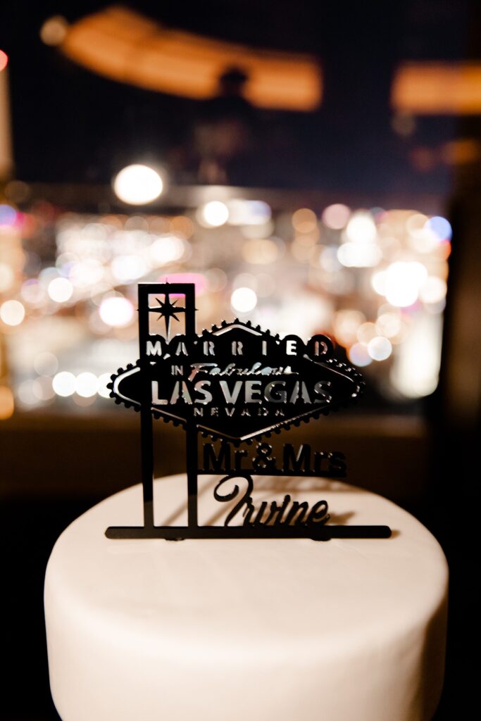 Wedding cake with a "married in Las Vegas" wedding topper at Skyfall Lounge at The W
