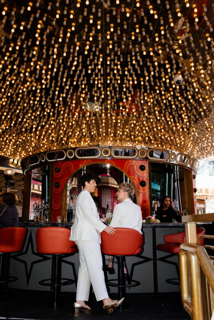 LGBTQ+ couple having drinks at Carousel Bar in downtown Las Vegas