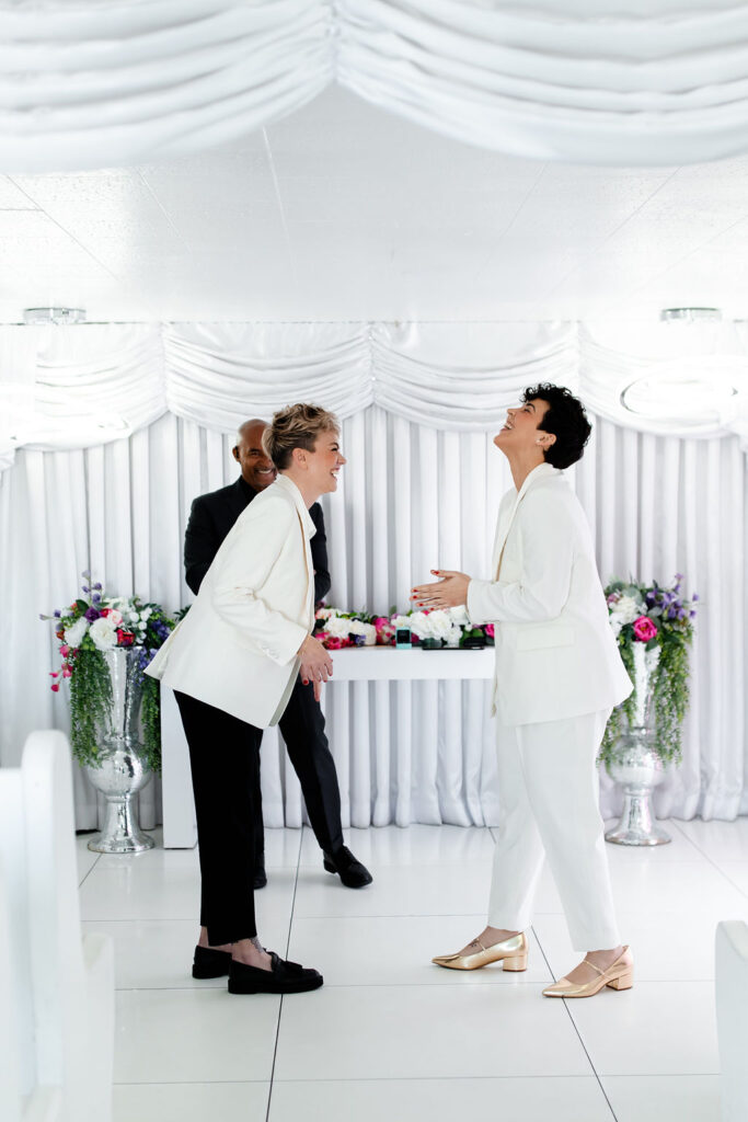 Couple laughing during their Las Vegas elopement ceremony