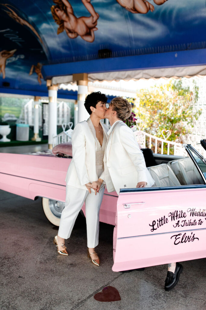 Couple kissing during their Las Vegas elopement photos at Little White Wedding Chapel