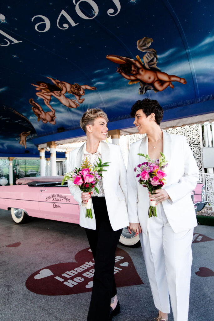 Couple posing in The Tunnel of Love at Little White Wedding Chapel