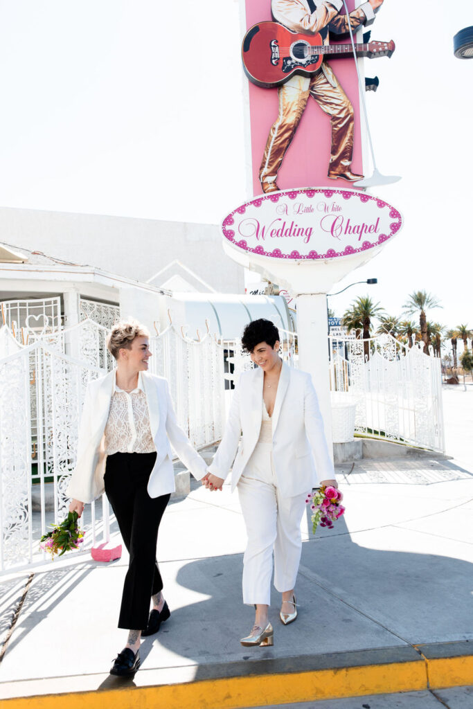 Couple posing outside of Little White Wedding Chapel in Las Vegas