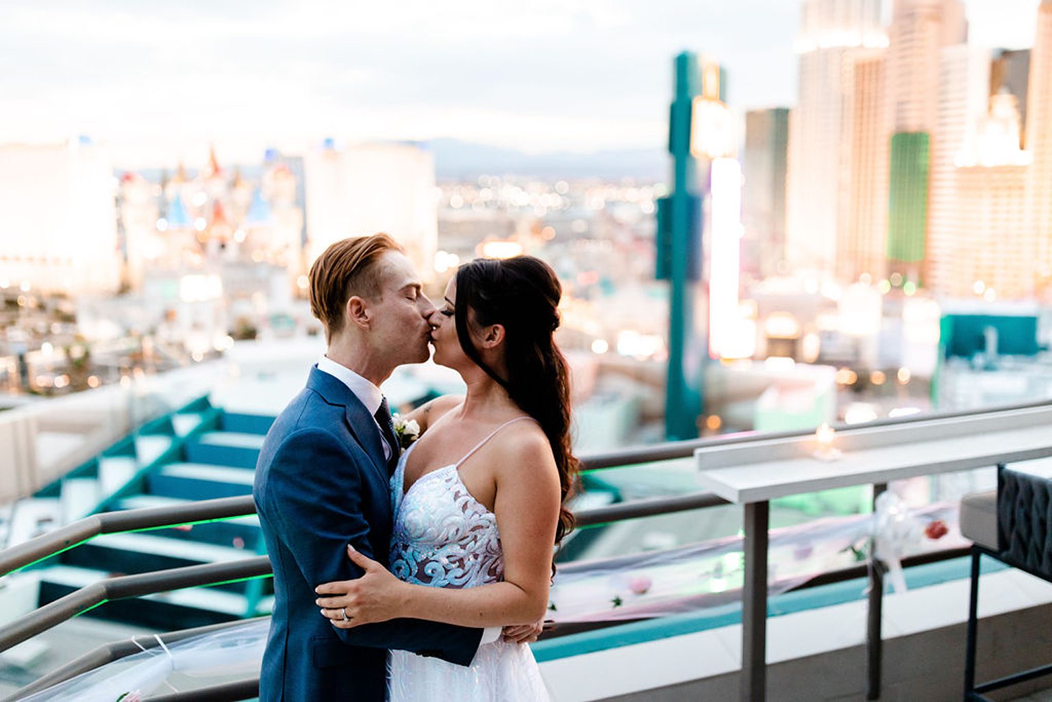 Bride and groom kissing during their Las Vegas wedding on a rooftop wedding venue