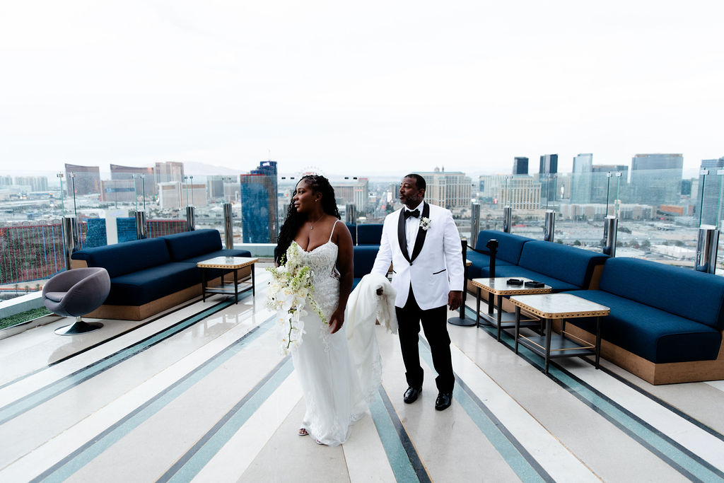 Bride and groom posing on a Las Vegas balcony