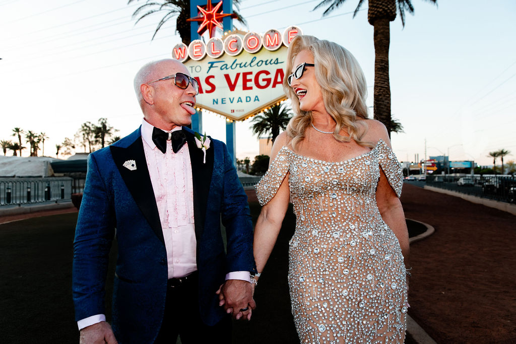 Couple posing in front of the the Welcome to Fabulous Las Vegas sign