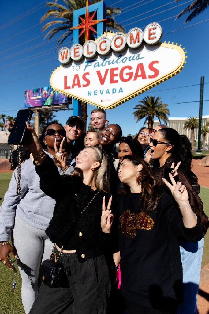 Friends posing in front of the Welcome to Fabulous Las Vegas sign