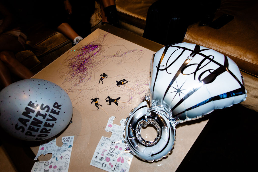 Close-up of holographic balloons and a giant diamond ring balloon