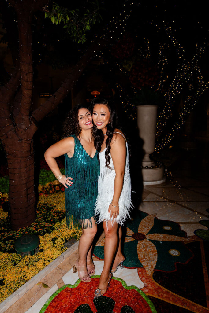 Bride posing with a friend for her Gatsby Glam Las Vegas bachelorette party