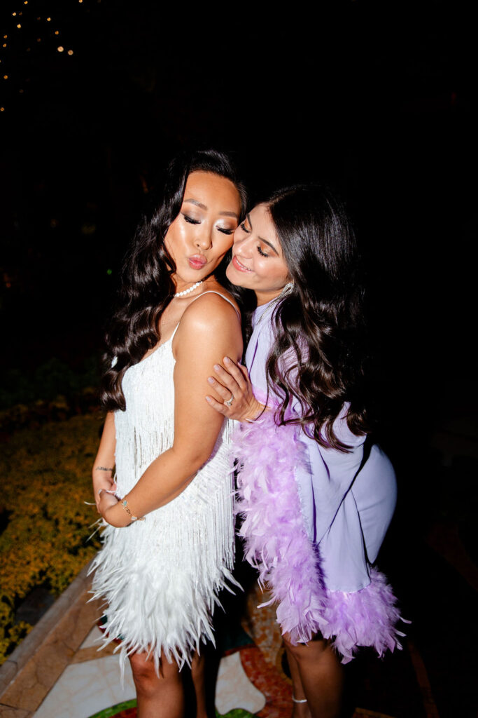 Bride posing with a friend for her Gatsby Glam Las Vegas bachelorette party