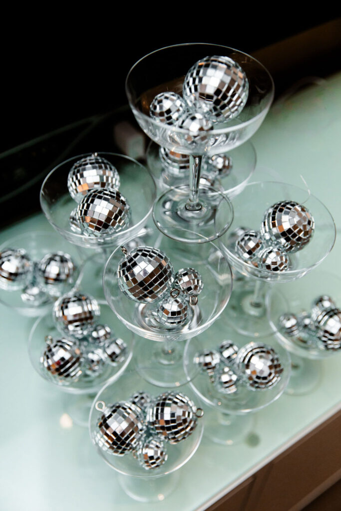 Champagne glasses with disco balls for a Last Disco bachelorette party