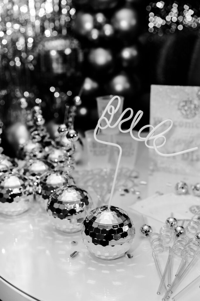 Last Disco bachelorette party decor ideas with disco cups and bride straw