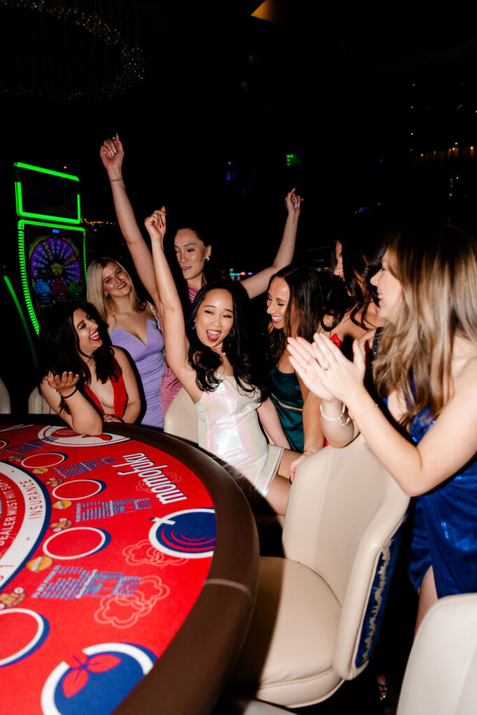 Bride and her friends playing casino games for her Vegas Gems (jewel toned) Las Vegas bachelorette party