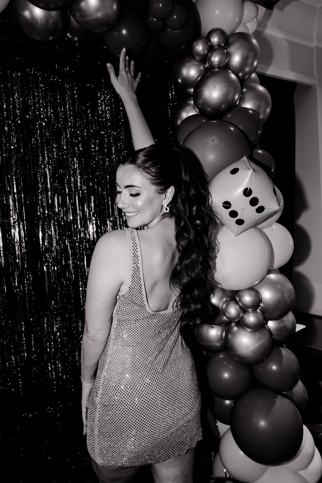 Black and white photo of a bride posing for her Lucky in Love Las Vegas bachelorette party photos