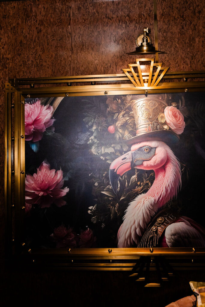 Glamorous flamingo painting in gold frame inside Pinky’s Vanderpump Las Vegas wedding reception venue.