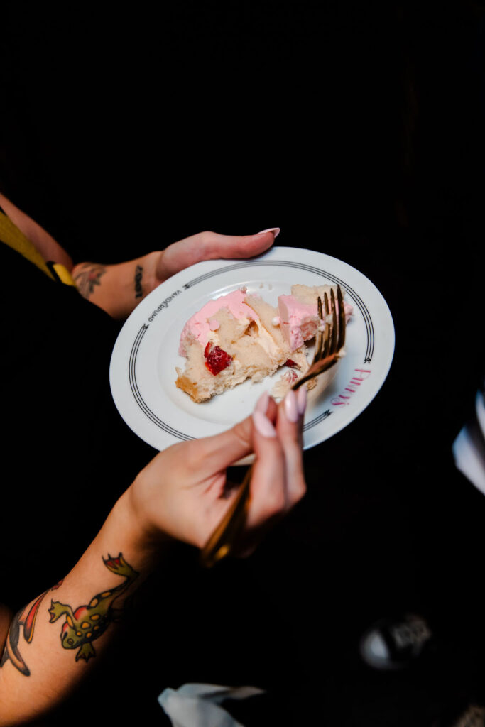 Wedding guest eating a slice of cake