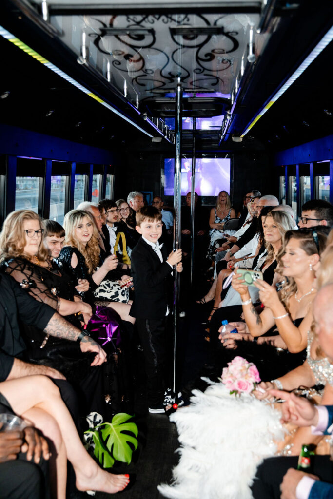 Couple on the party bus with friends and family