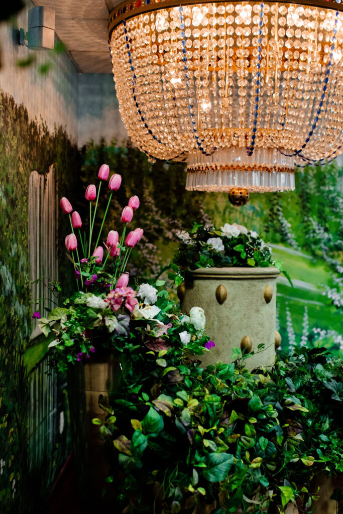 Murals, chandelier, and florals inside of Chapel Amore at The Little White Wedding Chapel