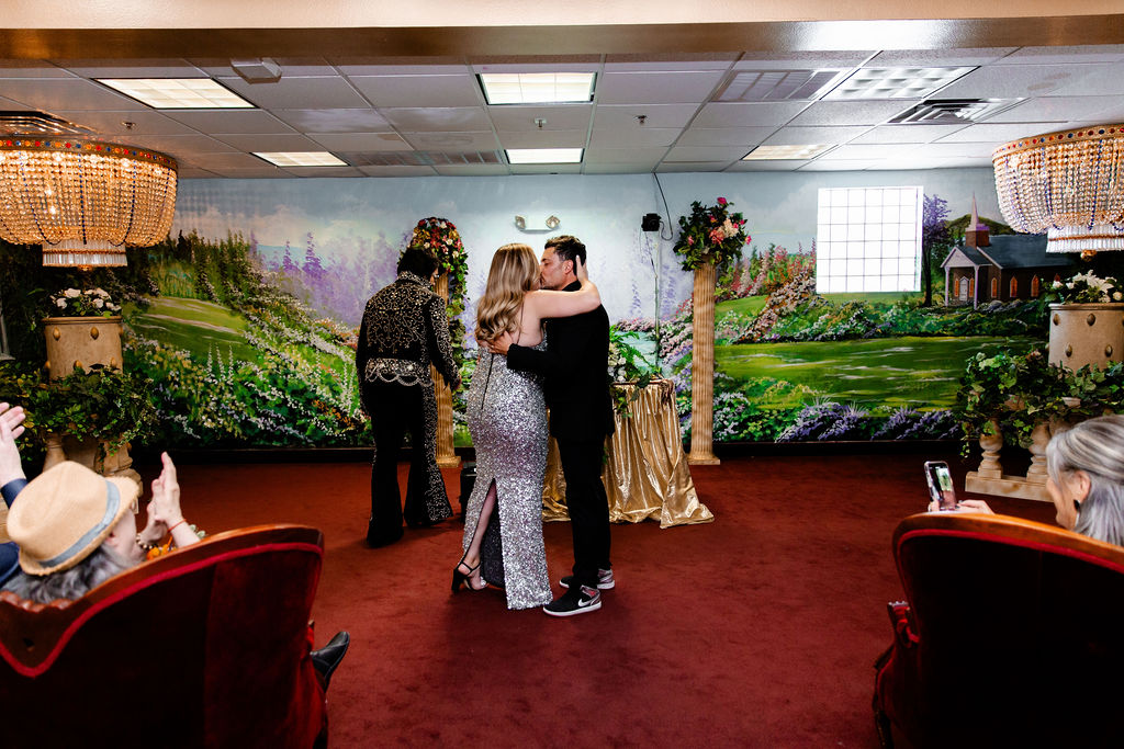 Couple kissing during their Chapel Amore wedding ceremony at The Little White Wedding Chapel