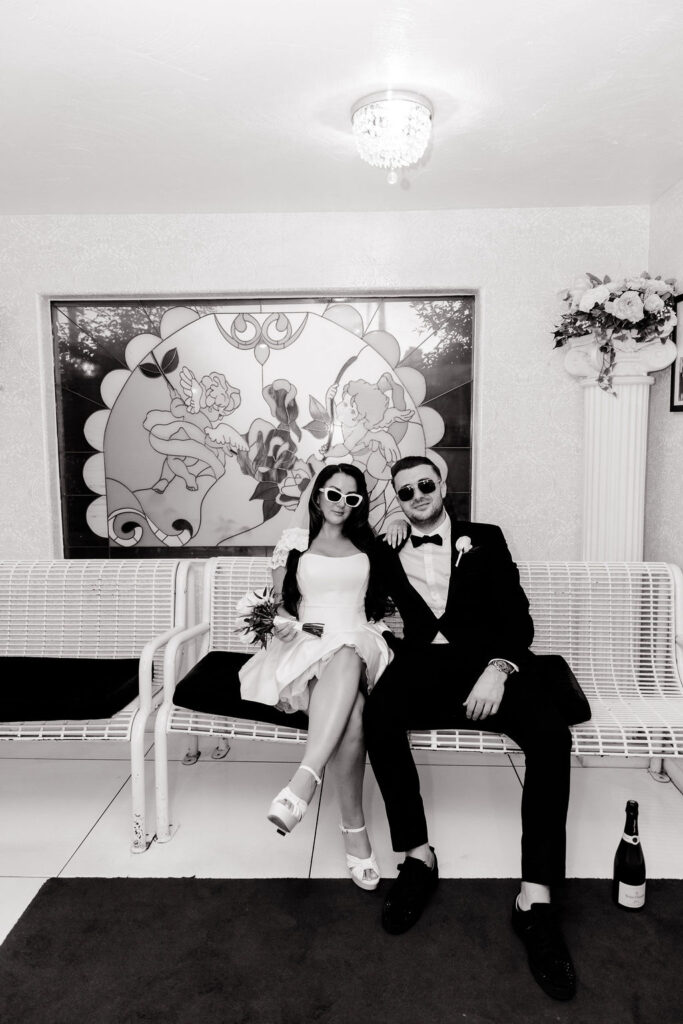 Black and white photo of a bride and groom waiting for their appointment at The Little White Wedding Chapel in Las Vegas