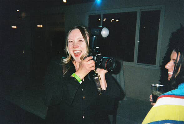 Ashlyn of Ashlyn Savannah Creative taking photos as the Las Vegas micro wedding photographer at a Mid Century Manor wedding reception