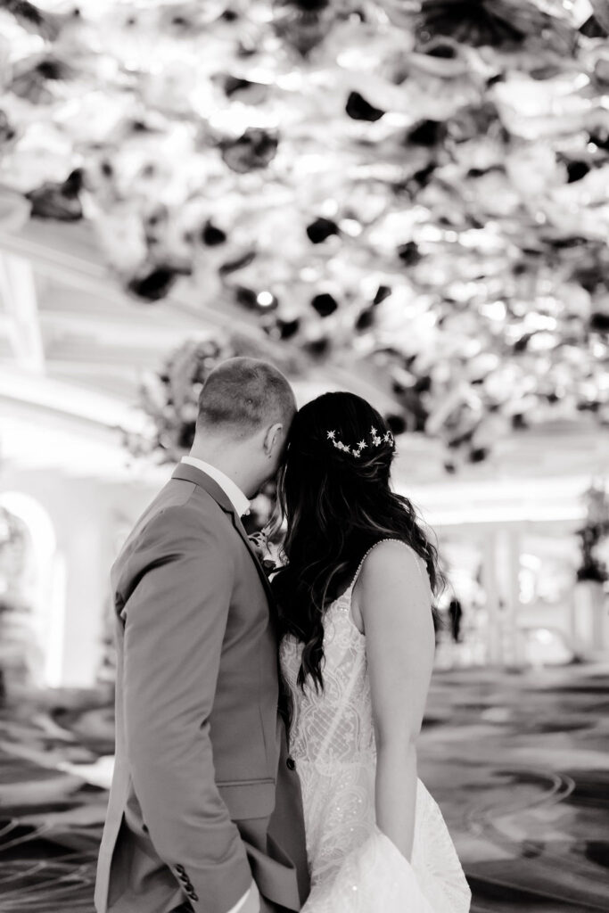 Black and white photo of a bride and groom posing in Bellagio Las Vegas