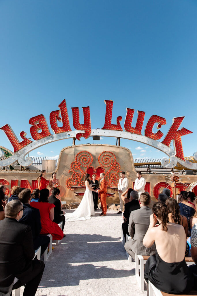 Bride and groom holding hands during their Neon Museum Las Vegas micro wedding