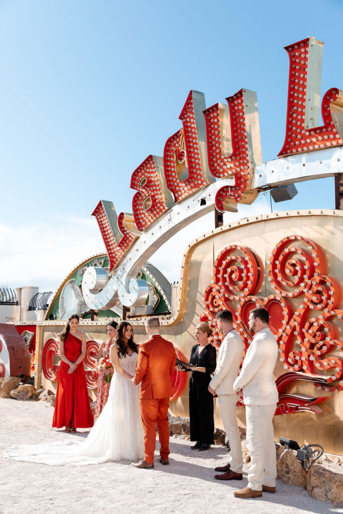 Bride and groom at the altar during their Neon Museum Las Vegas micro wedding ceremony