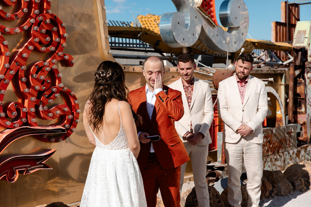 Groom getting emotional during his Neon Museum micro wedding in Las Vegas