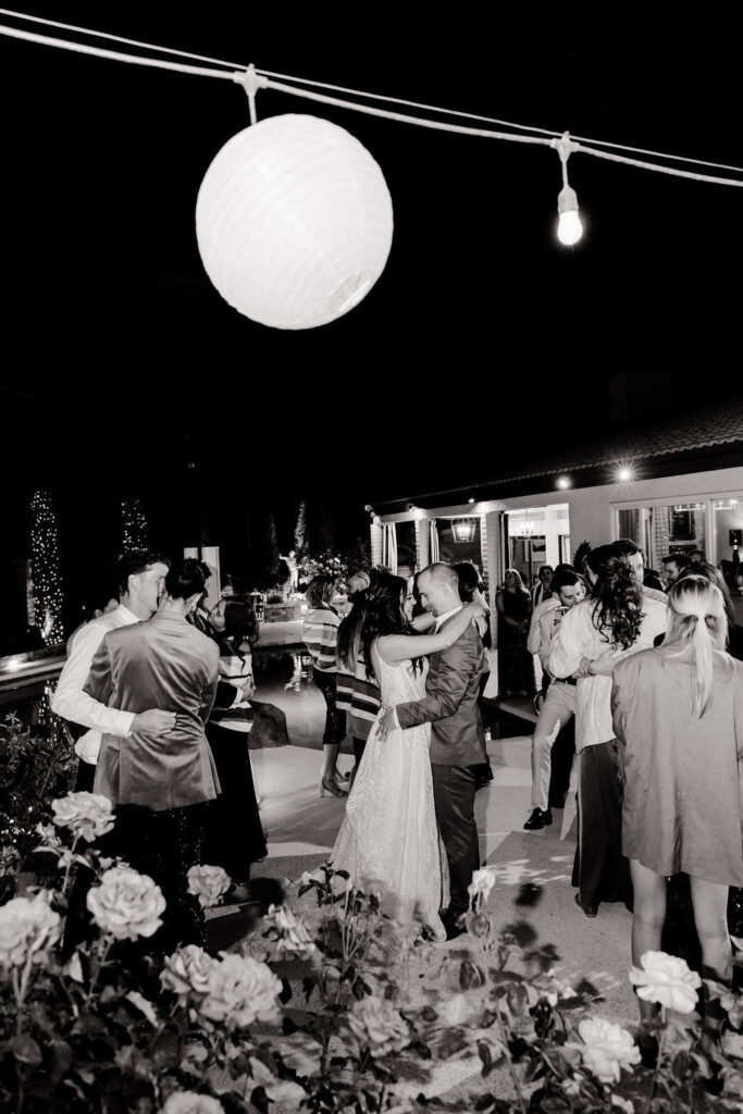 Black and white photo of a bride and groom dancing during their Mid Century Manor Las Vegas micro wedding reception