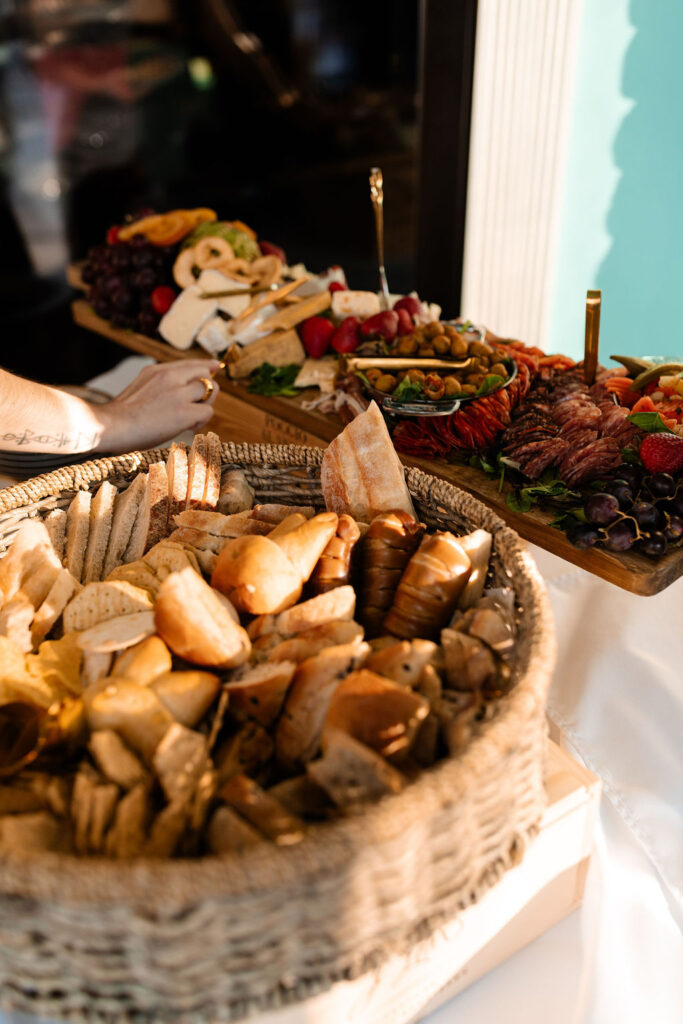 Charcuterie board and basket of bread at stylish Las Vegas micro wedding reception