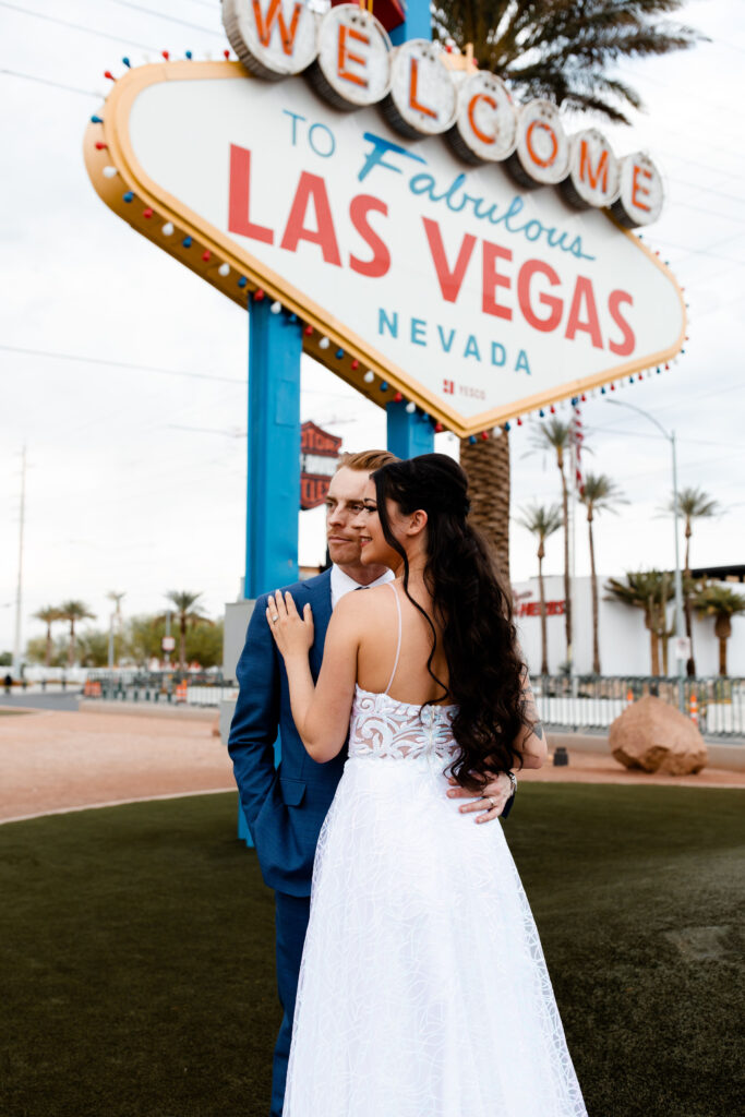 Editorial wedding portraits in front of the Welcome to Fabulous Las Vegas sign