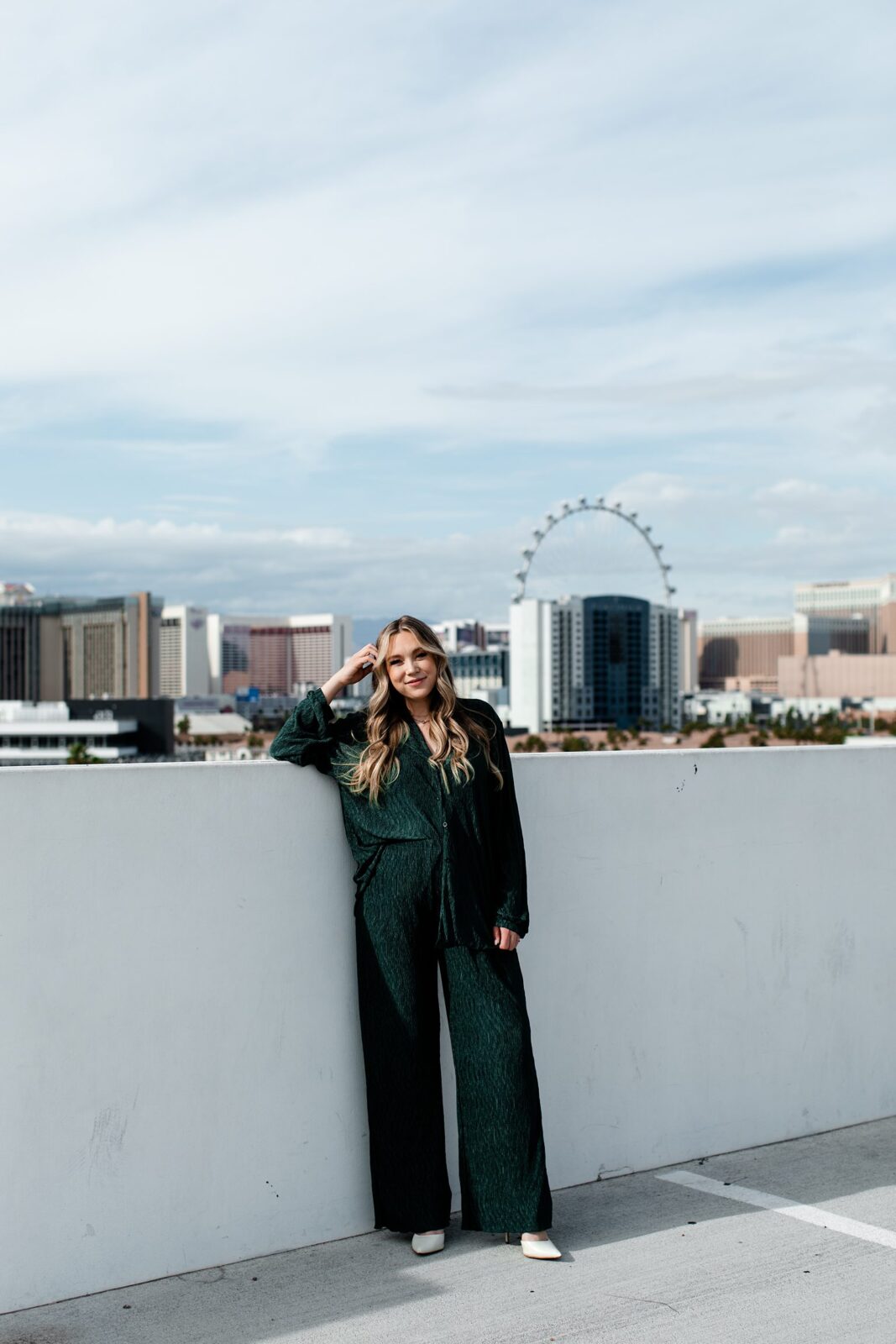Ashlyn Savannah - A JW Marriott Las Vegas wedding and elopement photographer posing on a rooftop