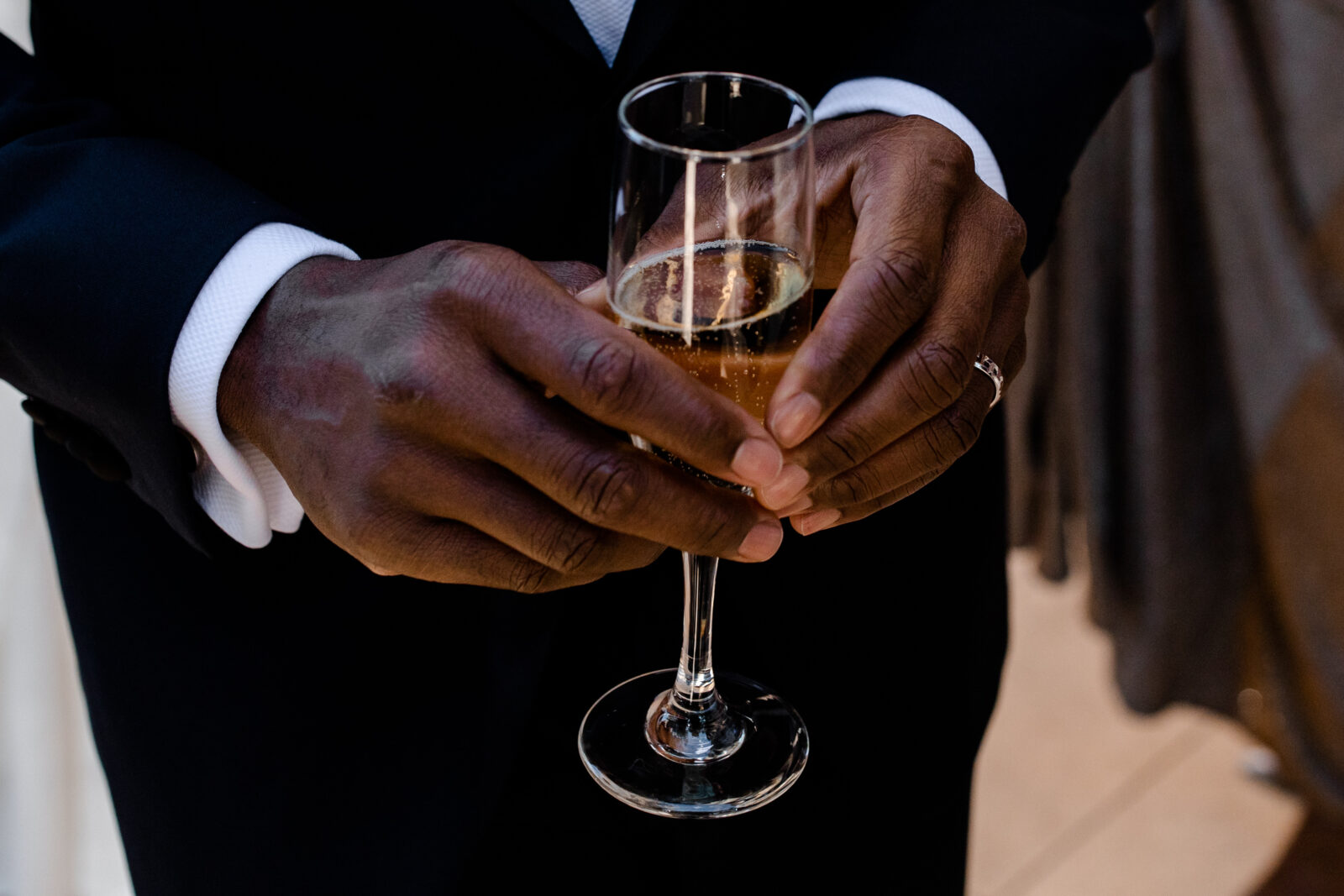 Groom holding a glass of champagne during Las Vegas wedding