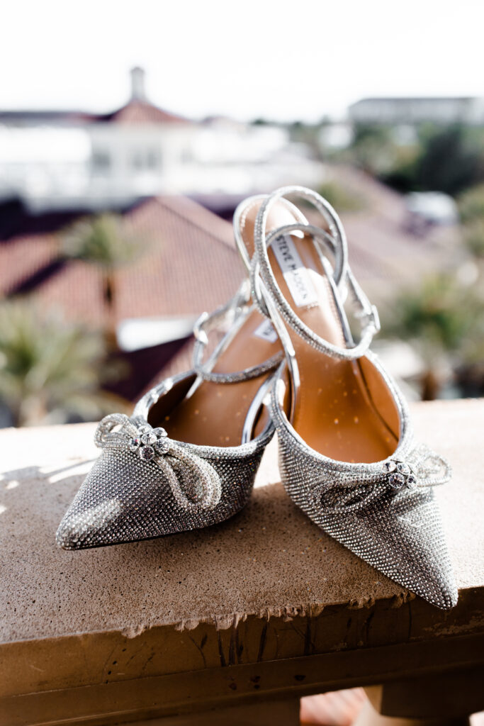Brides heels sitting on a balcony