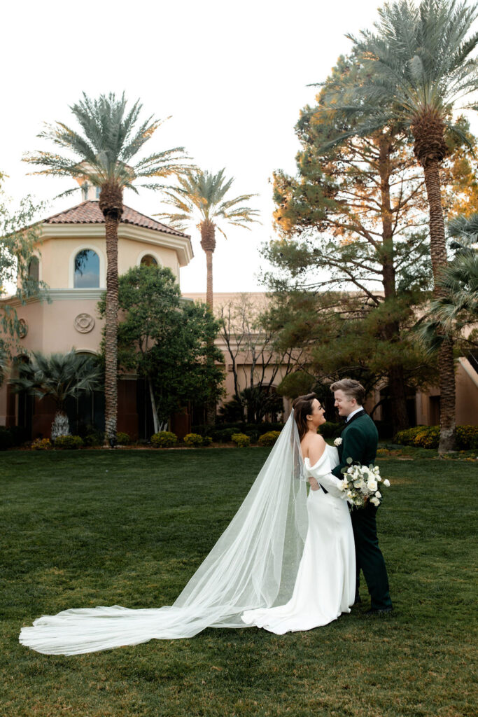 Bride and groom posing for outdoor portraits at JW Marriott Las Vegas wedding venue