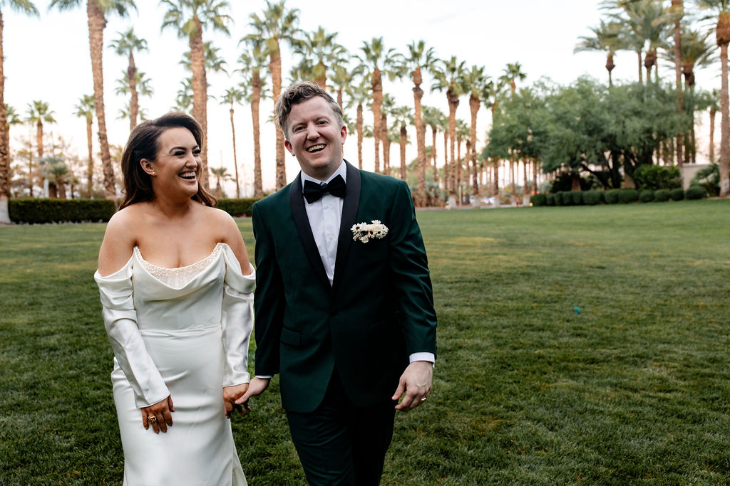 Bride and groom laughing and posing for their outdoor JW Marriott wedding portraits in Las Vegas