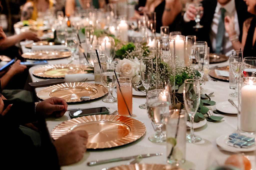Candid wedding reception photo of guests eating dinner from a JW Marriott Las Vegas wedding