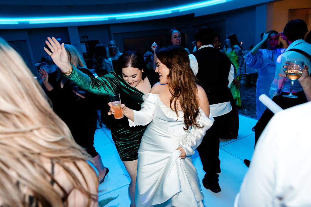 Bride dancing with guests during her JW Marriott Las Vegas wedding reception