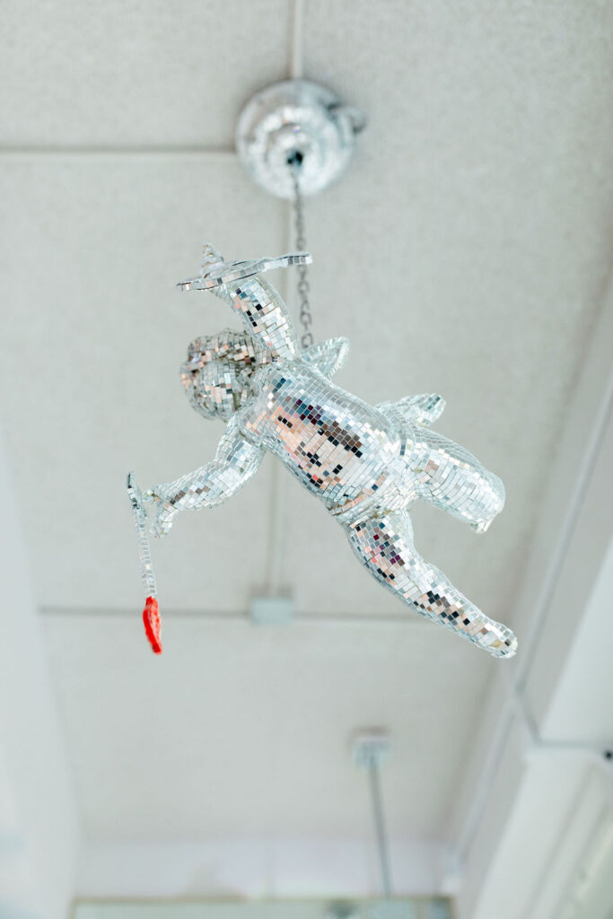 A sparkly cherub hanging from the ceiling at Sure Thing Too in Las Vegas