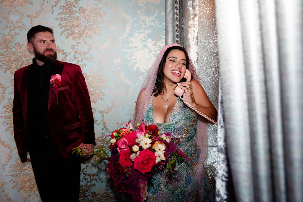 Bride talking into the vintage phone at Sure Thing Too