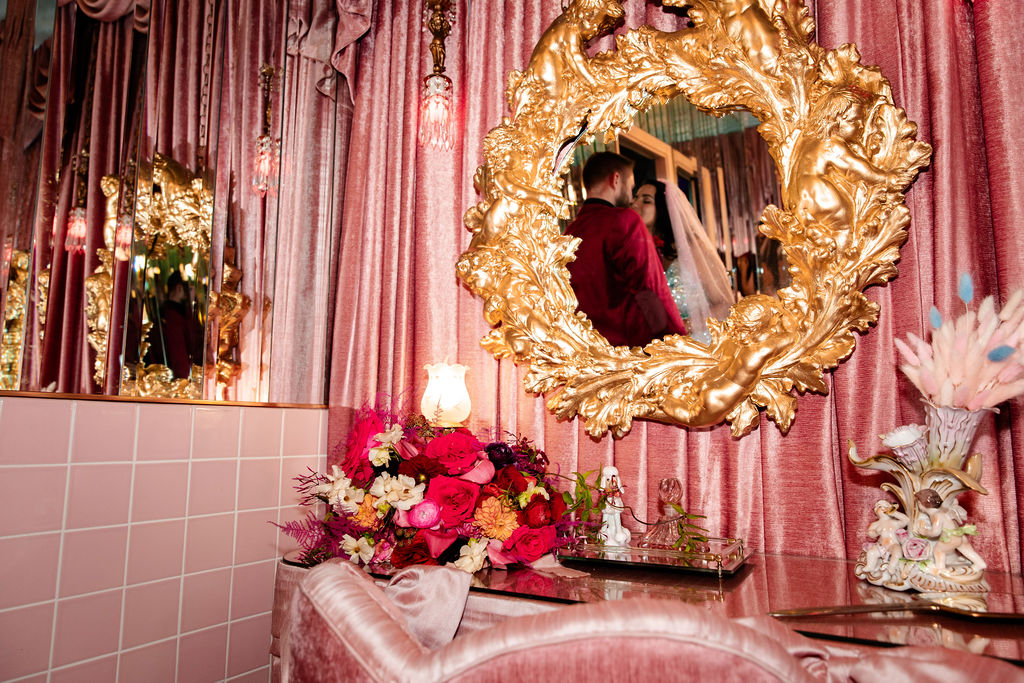 Bride and groom kissing in the bathroom at Sure Thing Too in Las Vegas